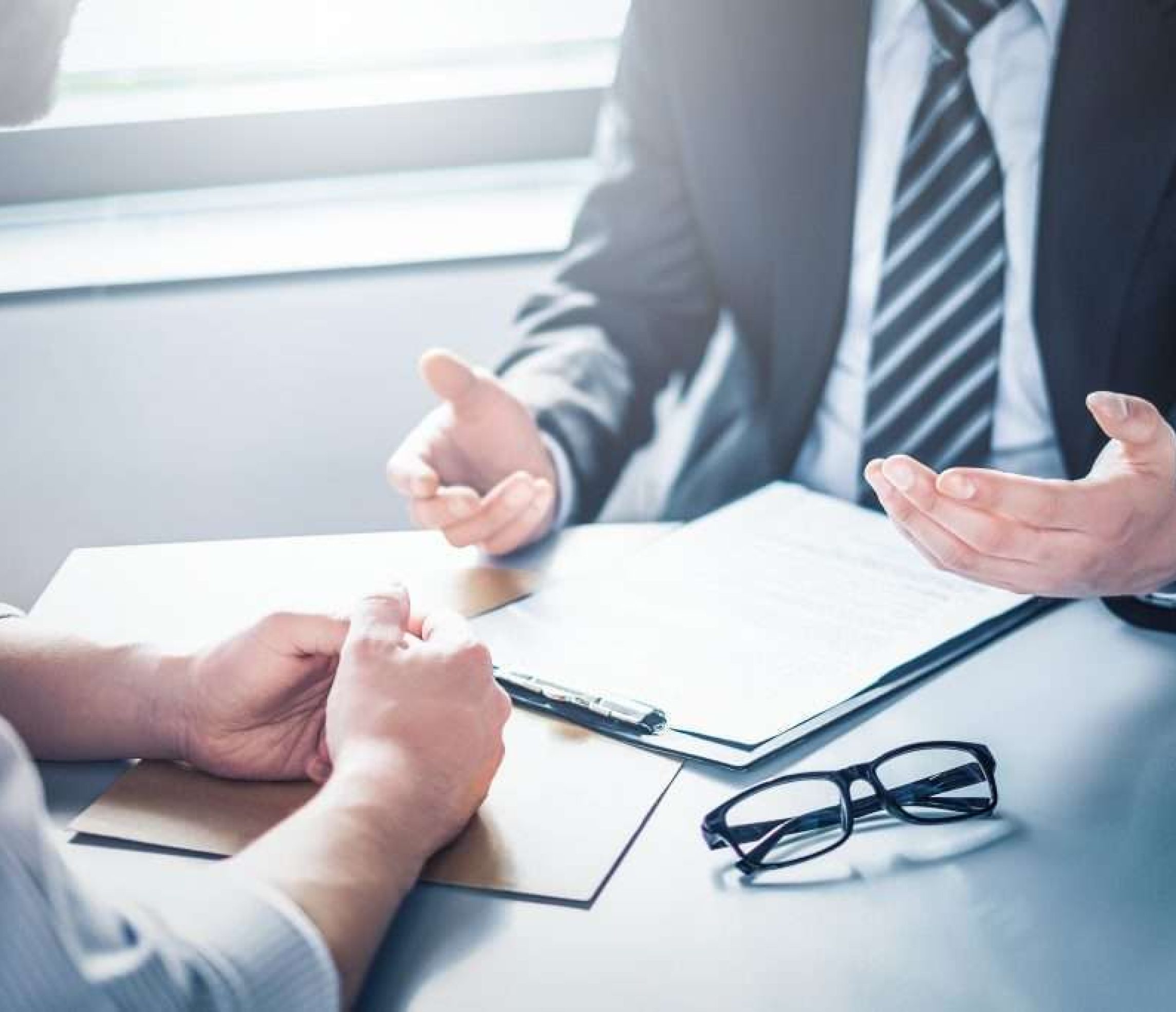 Business people negotiating a contract.