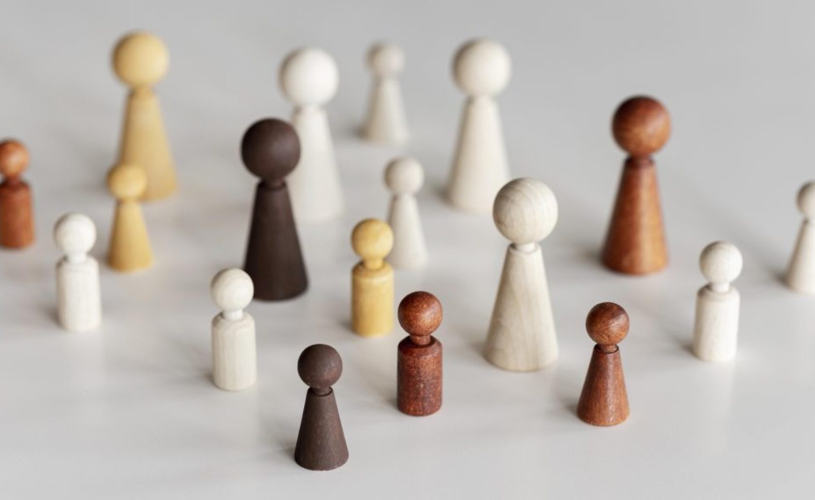 high-view-diverse-wooden-characters-inclusion-concept high-view-diverse-wooden-characters-inclusion-concept